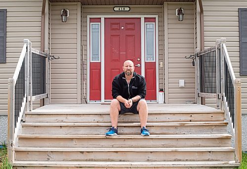 Mike Sudoma / Winnipeg Free Press
Justin Pescitelli sits gin the front steps of his home wearing gym attire Tuesday afternoon, longing to be back working out at the gym.
May 26, 2020
