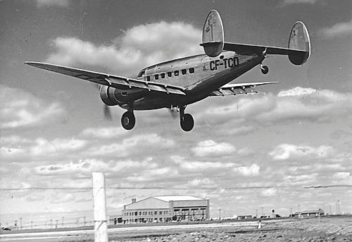 TRANS-CANADA AIRLINES

Lockheed 14 landing at Stevenson Field, Winnipeg. New hanger at airport in background.
1938
