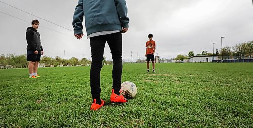 RUTH BONNEVILLE / WINNIPEG FREE PRESS

Sports - Soccer drills

A small group of teenage boys who normally play in a recreational soccer U15  soccer league practice some soccer drills at Sir John Franklin Soccer Field Thursday afternoon.  

Names:  Zevi Nathanson (blue hoodie)., Ariel Luquer (orange t-shirt) and  Ariel Kasztan (yellow runners) 

May 28, 2020