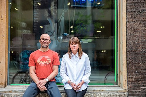 MIKAELA MACKENZIE / WINNIPEG FREE PRESS

Siblings Jennifer Goreski and Jon Thiessen, who have watched their mother's dementia deteriorate rapidly during isolation, pose for a portrait outside of their luggage shop in Winnipeg on Friday, May 29, 2020. For Eva Wasney story.
Winnipeg Free Press 2020.