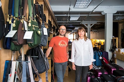 MIKAELA MACKENZIE / WINNIPEG FREE PRESS

Siblings Jennifer Goreski and Jon Thiessen, who have watched their mother's dementia deteriorate rapidly during isolation, pose for a portrait in their luggage shop in Winnipeg on Friday, May 29, 2020. For Eva Wasney story.
Winnipeg Free Press 2020.