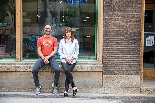 MIKAELA MACKENZIE / WINNIPEG FREE PRESS

Siblings Jennifer Goreski and Jon Thiessen, who have watched their mother's dementia deteriorate rapidly during isolation, pose for a portrait outside of their luggage shop in Winnipeg on Friday, May 29, 2020. For Eva Wasney story.
Winnipeg Free Press 2020.