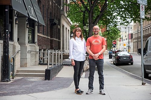 MIKAELA MACKENZIE / WINNIPEG FREE PRESS

Siblings Jennifer Goreski and Jon Thiessen, who have watched their mother's dementia deteriorate rapidly during isolation, pose for a portrait outside of their luggage shop in Winnipeg on Friday, May 29, 2020. For Eva Wasney story.
Winnipeg Free Press 2020.