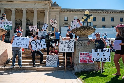 Daniel Crump / Winnipeg Free Press. A small group of anti-lockdown protestors gather at the Manitoba Legislature. The group is calling for the removal of all coronavirus related lockdown restrictions. May 30, 2020.