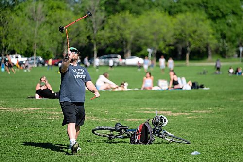 Daniel Crump / Winnipeg Free Press. Bryan Foerster practices with his flower sticks in Assiniboine Park. He purchased sticks at Folkfest a few years ago and says he even though the festival was cancelled this year he is happy to be able to come to the park to practice. May 30, 2020.