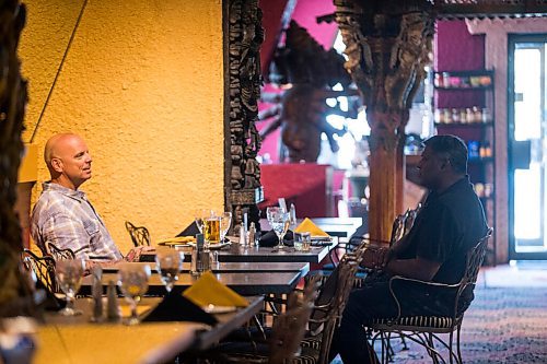 MIKAELA MACKENZIE / WINNIPEG FREE PRESS

Dave Lysyk (left) and Raj Santiago dine at the East India Company on re-opening day in Winnipeg on Monday, June 1, 2020. For Malak Abas story.
Winnipeg Free Press 2020.