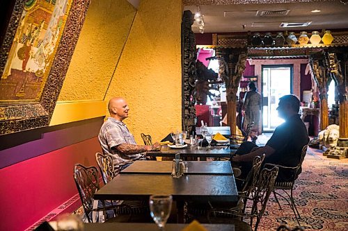 MIKAELA MACKENZIE / WINNIPEG FREE PRESS

Dave Lysyk (left) and Raj Santiago dine at the East India Company on re-opening day in Winnipeg on Monday, June 1, 2020. For Malak Abas story.
Winnipeg Free Press 2020.