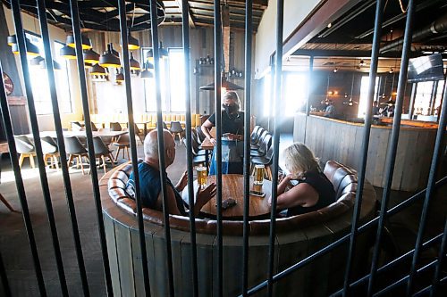 JOHN WOODS / WINNIPEG FREE PRESS
Kyla Fletcher, supervisor at Brazen Hall, serves customers Valerie and Bill Anderson on the first day of COVID phase 2 opening Monday, June 1, 2020. 

Reporter: Abas