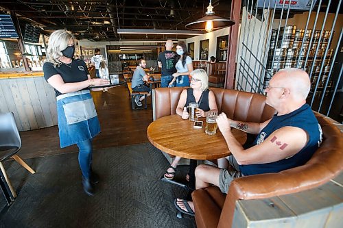 JOHN WOODS / WINNIPEG FREE PRESS
Kyla Fletcher, supervisor at Brazen Hall, serves customers Valerie and Bill Anderson on the first day of COVID phase 2 opening Monday, June 1, 2020. 

Reporter: Abas