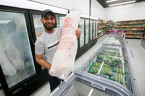 JOHN WOODS / WINNIPEG FREE PRESS
Mohammad Naser, owner of Tarboosh Middle Eastern, carries a lamb in his new grocery store which specializes in Middle Eastern food in Winnipeg Tuesday, June 2, 2020. 

Reporter: Waldman