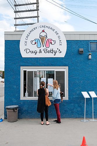 Daniel Crump / Winnipeg Free Press. Customers order ice cream from the take out window at Dug + Bettys on Des Muerons Street. June 2, 2020.