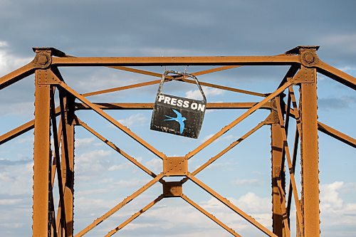 Mike Sudoma / Winnipeg Free Press
A car door painted with the words Press On sits atop the St James train bridge Tuesday afternoon
June 2, 2020