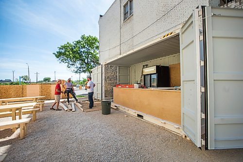 MIKAELA MACKENZIE / WINNIPEG FREE PRESS

Beer Can organizers John Scoles (left), Jeremy Ritsema, and Brad Chute work on the new live music venue and pop-up beer tent area in Winnipeg on Wednesday, June 3, 2020. For Al Small story.
Winnipeg Free Press 2020.