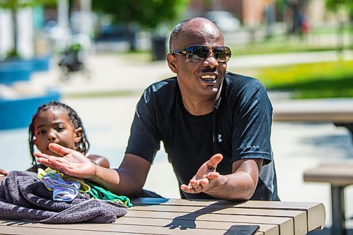 MIKAELA MACKENZIE / WINNIPEG FREE PRESS

Huruy Geberslasie speaks to a reporter at the splash pad at Central Park on the first day of re-opening in Winnipeg on Wednesday, June 3, 2020. For Kellen story.
Winnipeg Free Press 2020.