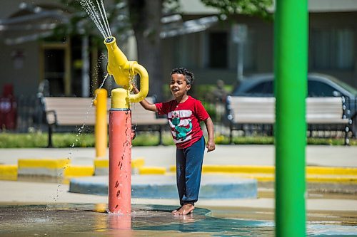 MIKAELA MACKENZIE / WINNIPEG FREE PRESS

Equinan Geberslasie plays at the splash pad at Central Park on the first day of re-opening in Winnipeg on Wednesday, June 3, 2020. For Kellen story.
Winnipeg Free Press 2020.