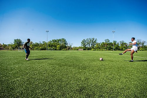 MIKAELA MACKENZIE / WINNIPEG FREE PRESS

Raphael Ohin (left) and Solomon Kojo Antwi pass the ball back and forth at Glenlawn Collegiate Memorial Park Turf Field in Winnipeg on Thursday, June 4, 2020. Valour can resume training on Sunday in small groups. For Taylor Allen story.
Winnipeg Free Press 2020.