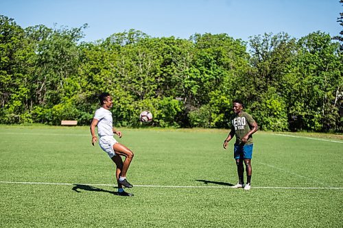 MIKAELA MACKENZIE / WINNIPEG FREE PRESS

Solomon Kojo Antwi (left) and Raphael Ohin juggle the ball at Glenlawn Collegiate Memorial Park Turf Field in Winnipeg on Thursday, June 4, 2020. Valour can resume training on Sunday in small groups. For Taylor Allen story.
Winnipeg Free Press 2020.