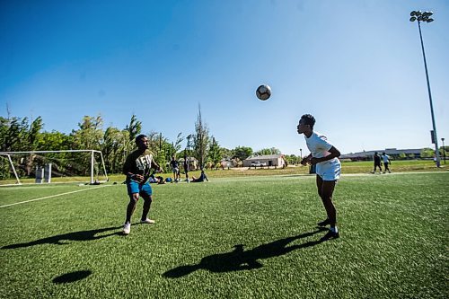 MIKAELA MACKENZIE / WINNIPEG FREE PRESS

Raphael Ohin (left) and Solomon Kojo Antwi juggle the ball at Glenlawn Collegiate Memorial Park Turf Field in Winnipeg on Thursday, June 4, 2020. Valour can resume training on Sunday in small groups. For Taylor Allen story.
Winnipeg Free Press 2020.