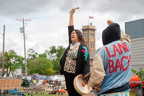Mike Sudoma / Winnipeg Free Press
Activist Brielle Beardy-Linklater holds up their hand after leading a drum song during a rally put on by the Aboriginal Youth Organization Wednesday afternoon
June 10, 2020