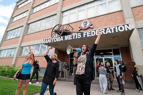 Mike Sudoma / Winnipeg Free Press
Protesters put their hands in the air in front of the Manitoba Metis Federation building Wednesday afternoon to show support to the homeless who had been forcibly evicted from their homes in the camps along Henry St. 
Brielle Beardy-Linklater is holding horn.
June 10, 2020
