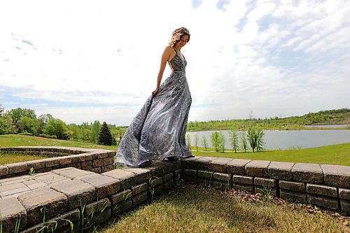 RUTH BONNEVILLE / WINNIPEG FREE PRESS
49.8 grads - River East Collegiate
Reagan Hofer, River East Collegiate (18yrs), tries on her jewelled ballroom gown that bought her dress in October for her grad. Photos taken at her home in Birds Hill.
VIRUS GRADE 12 49.8: After 13 years in the K-12 education system, they were only months away from earning their diplomas, celebrating at grad pow wows and renting limos as backgrounds for their prom photos when the school year was called off. The celebrations they have long awaited have either been moved online, postponed or cancelled. The pandemic has seemingly targeted the Class of 2020, who will enter job markets or post-secondary at an unprecedented time, without many of the rites of passages the graduates before them took for granted. It sucks. We're going to be talking to tons of students about their final year and snapping photos of them in their formal attire, pow wow regalia and convocation gowns. (RUNNING JUNE 13)
Maggie Macintosh
Education Reporter - Winnipeg Free Press
June 3, 2020