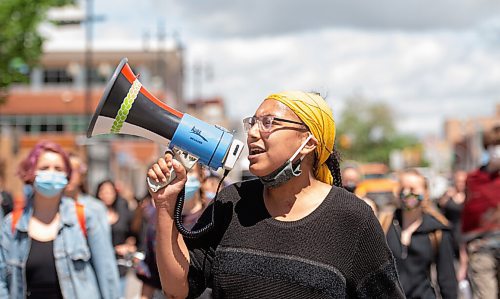 Mike Sudoma / Winnipeg Free Press
Activist, Jayla Shellcross speaks to protesters as they march to City Hall in support of the homeless who have been forcibly evicted from their camp along Henry St by the City of Winnipeg Wednesday
June 10, 2020