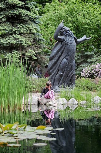 RUTH BONNEVILLE / WINNIPEG FREE PRESS

Local - Standup Leo Mol Garden open. 

Seven-year-old Amelie Le (with circumflex over the e), seems contemplative as she plays in the pond in the Leo Mol Sculpture Garden while hanging out with her grandmother Thursday. 

The English Garden and the Leo Mol Sculpture garden opened to the public on Tuesday.


June 11,  2020