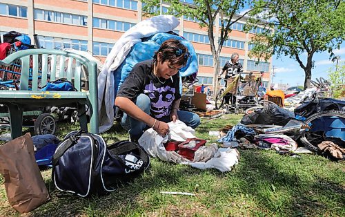 RUTH BONNEVILLE / WINNIPEG FREE PRESS

Local - Disraeli Encampment 

Carla Otcheek carefully wraps up two jewellery boxes that she is saving to give to her children when she see's them next while gathering her belongings Friday. 

People without a permanent home pack up their personal belongings after being asked to vacate the land next to the MMF building on Friday.  They were given more time to remove their items before a cleanup crew came.


See JS story.


June 12,  2020