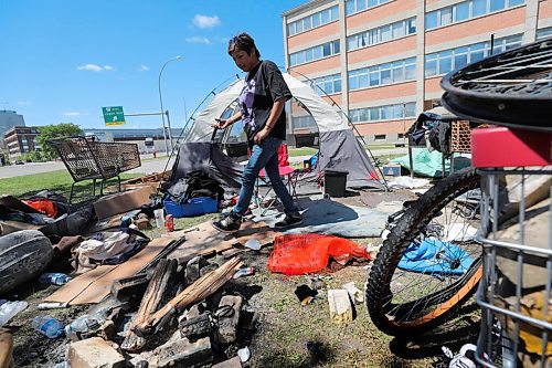 RUTH BONNEVILLE / WINNIPEG FREE PRESS

Local - Disraeli Encampment 

Carla Otcheek goes through her belongings while chatting with a FP reporter Friday. 

People without a permanent home pack up their personal belongings after being asked to vacate the land next to the MMF building on Friday.  They were given more time to remove their items before a cleanup crew came.


See JS story.


June 12,  2020