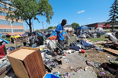 RUTH BONNEVILLE / WINNIPEG FREE PRESS

Local - Disraeli Encampment 

Robert Russell, a spokesperson for the group, goes through his belongings after chatting with a FP reporter Friday. 

People without a permanent home pack up their personal belongings after being asked to vacate the land next to the MMF building on Friday.  They were given more time to remove their items before a cleanup crew came.


See JS story.


June 12,  2020