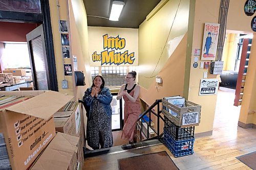 SHANNON VANRAES / WINNIPEG FREE PRESS
Frances Koncan and Reba Terlson apply hand sanitizer while entering Into The Music in Winnipeg's Exchange District on June 12, 2020.