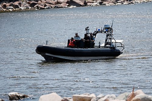 JOHN WOODS / WINNIPEG FREE PRESS
Members of RCMP search as the Kurdish community await answers from a water search for a leading member of the community at Belair boat launch Sunday, June 14, 2020. One person died and another is missing after their boat capsized yesterday on Lake Winnipeg.