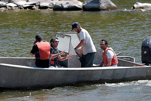 JOHN WOODS / WINNIPEG FREE PRESS
A commercial fisherman assists members of the Kurdish community in a water search for a leading member of the community at Belair boat launch Sunday, June 14, 2020. One person died and another is missing after their boat capsized yesterday on Lake Winnipeg.