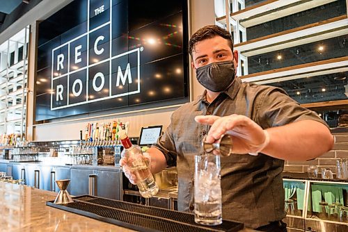 JESSE BOILY  / WINNIPEG FREE PRESS
Mathiew Martel makes a drink at the Rec Room on Monday.  Rec Room is slowly phasing their opening with the patio first.
 Monday, June 15, 2020.
Reporter: Randall King