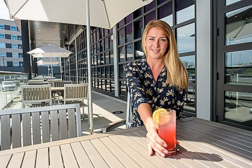 JESSE BOILY  / WINNIPEG FREE PRESS
Agnes Krahn, the manager of the Rec Room in Winnipeg, sits on the patio and shows one of the drinks offered at the Rec Room on Monday. Rec Room is slowly phasing their opening with the patio first. Monday, June 15, 2020.
Reporter: Randall King