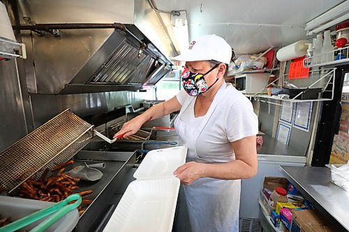 RUTH BONNEVILLE / WINNIPEG FREE PRESS

49.8 - Sis & Me food truck

Joyce & Garry Powers, Sis & Me food truck, parked at Broadway & Edmonton. 

Joyce makes home-cut fries in her truck Tuesday. 

Story: This is for an Intersection piece on Sis & Me, a food truck celebrating its 25th anniversary on the streets of Winnipeg. Owners Joyce & Garry were one of two food trucks on Broadway when they started - mostly hot dog carts back then. They've been going strong ever since, and now that they're allowed back on the street - their license was delayed 'til May 1 this year owing to COVID - their reg customers are welcoming them back with open arms.


Story is due to run Sat June 20 - Dave Sanderson story,. 

June 16,  2020
