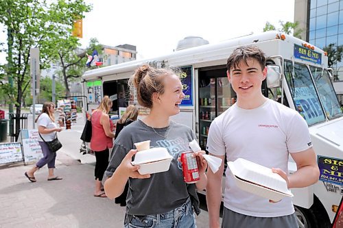 RUTH BONNEVILLE / WINNIPEG FREE PRESS

49.8 - Sis & Me food truck

Joyce & Garry Powers, Sis & Me food truck, parked at Broadway & Edmonton. 

Jenna MacDonald is all smiles as she pics up her sweet potato fries order with her boyfriend Desmond Langan over the lunch hour Tuesday.  

Story: This is for an Intersection piece on Sis & Me, a food truck celebrating its 25th anniversary on the streets of Winnipeg. Owners Joyce & Garry were one of two food trucks on Broadway when they started - mostly hot dog carts back then. They've been going strong ever since, and now that they're allowed back on the street - their license was delayed 'til May 1 this year owing to COVID - their reg customers are welcoming them back with open arms.


Story is due to run Sat June 20 - Dave Sanderson story,. 

June 16,  2020