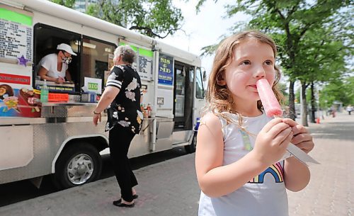 RUTH BONNEVILLE / WINNIPEG FREE PRESS

49.8 - Sis & Me food truck

Joyce & Garry Powers, Sis & Me food truck, parked at Broadway & Edmonton.  

Adele Matthews (5yrs), cools herself with a popsicle with her mom and brother Dylan (8yrs), over the lunch hour Tuesday. 

Story: This is for an Intersection piece on Sis & Me, a food truck celebrating its 25th anniversary on the streets of Winnipeg. Owners Joyce & Garry were one of two food trucks on Broadway when they started - mostly hot dog carts back then. They've been going strong ever since, and now that they're allowed back on the street - their license was delayed 'til May 1 this year owing to COVID - their reg customers are welcoming them back with open arms.


Story is due to run Sat June 20 - Dave Sanderson story,. 

June 16,  2020