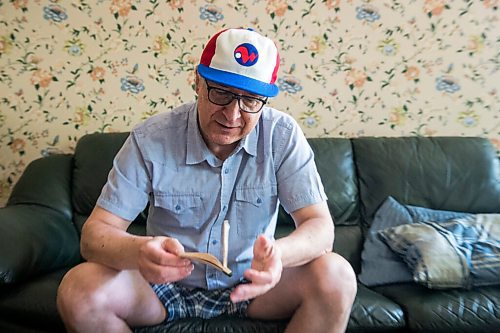 MIKAELA MACKENZIE / WINNIPEG FREE PRESS

Jeff Solylo, Winnipeg Whips fan, poses for a portrait with some of the team paraphernalia that he's kept from when he was a kid in Winnipeg on Tuesday, June 16, 2020. For Jason Bell story.
Winnipeg Free Press 2020.