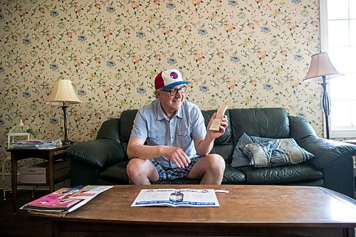 MIKAELA MACKENZIE / WINNIPEG FREE PRESS

Jeff Solylo, Winnipeg Whips fan, poses for a portrait with some of the team paraphernalia that he's kept from when he was a kid in Winnipeg on Tuesday, June 16, 2020. For Jason Bell story.
Winnipeg Free Press 2020.