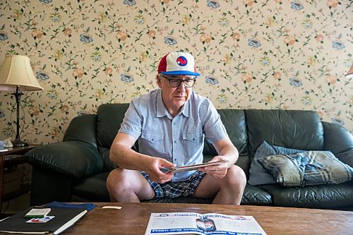 MIKAELA MACKENZIE / WINNIPEG FREE PRESS

Jeff Solylo, Winnipeg Whips fan, poses for a portrait with some of the team paraphernalia that he's kept from when he was a kid in Winnipeg on Tuesday, June 16, 2020. For Jason Bell story.
Winnipeg Free Press 2020.