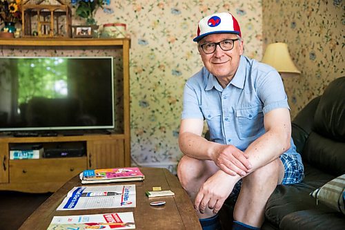 MIKAELA MACKENZIE / WINNIPEG FREE PRESS

Jeff Solylo, Winnipeg Whips fan, poses for a portrait with some of the team paraphernalia that he's kept from when he was a kid in Winnipeg on Tuesday, June 16, 2020. For Jason Bell story.
Winnipeg Free Press 2020.