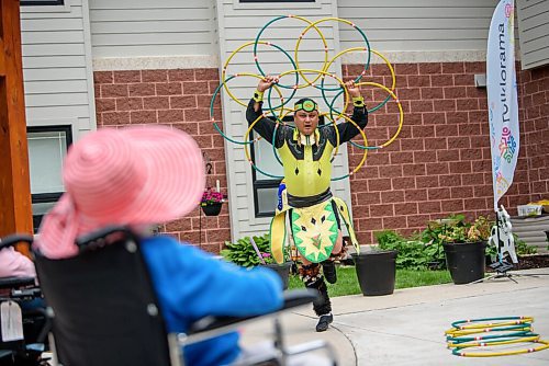 JESSE BOILY  / WINNIPEG FREE PRESS
A performer dances at the Folklorama at home at the River Park Gardens home care centre on Tuesday.  Folklorama shifted their programming after the cancelation of the 51st festival and have shifted into different models over the summer.  Tuesday, June 16, 2020.
Reporter: GABRIELLE