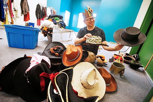 JOHN WOODS / WINNIPEG FREE PRESS
Kent Suss, Manitoba Theatre for Young People (MTYP) Summer Theatre Camp director and instructor, tries on a crown as he organizes and prepares the prop and costume room for the upcoming theatre camp Tuesday, June 16, 2020. MTYP is offering online courses and an onsite camp from July 6-August 28.

Reporter: King