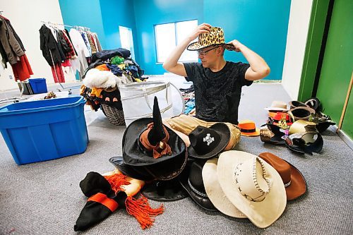 JOHN WOODS / WINNIPEG FREE PRESS
Kent Suss, Manitoba Theatre for Young People (MTYP) Summer Theatre Camp director and instructor, tries on some hats as he organizes and prepares the prop and costume room for the upcoming theatre camp Tuesday, June 16, 2020. MTYP is offering online courses and an onsite camp from July 6-August 28.

Reporter: King