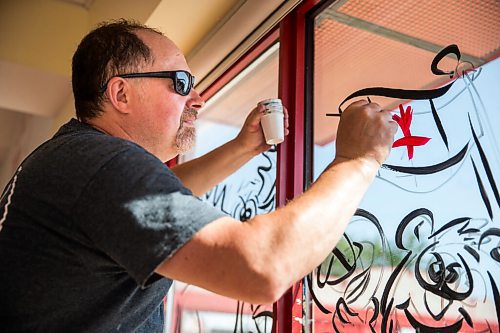 MIKAELA MACKENZIE / WINNIPEG FREE PRESS

Todd Van Hussen paints Canada Day window art at The Crusty Bun in Winnipeg on Wednesday, June 17, 2020. For Ben Waldman story.
Winnipeg Free Press 2020.