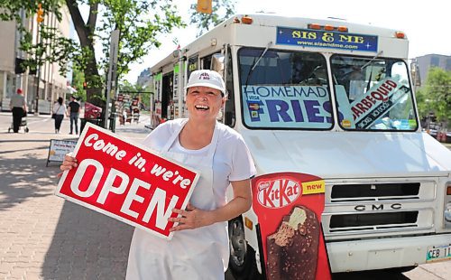 RUTH BONNEVILLE / WINNIPEG FREE PRESS

49.8 - Sis & Me food truck

Joyce & Garry Powers, Sis & Me food truck, parked at Broadway & Edmonton.  

Fun photo of Joyce holding her open sign in front of her food truck.

Story: This is for an Intersection piece on Sis & Me, a food truck celebrating its 25th anniversary on the streets of Winnipeg. Owners Joyce & Garry were one of two food trucks on Broadway when they started - mostly hot dog carts back then. They've been going strong ever since, and now that they're allowed back on the street - their license was delayed 'til May 1 this year owing to COVID - their reg customers are welcoming them back with open arms.


Story is due to run Sat June 20 - Dave Sanderson story,. 

June 16,  2020