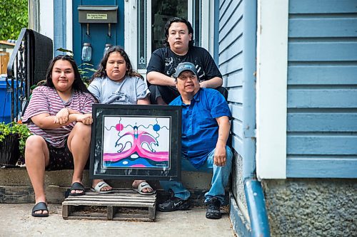 MIKAELA MACKENZIE / WINNIPEG FREE PRESS

Jayden (left), Jimmie, Jackson III, and father Byron Beardy pose for a portrait on the front steps of their home with a piece of art by Jackson Beardy (Byron's father) in Winnipeg on Thursday, June 18, 2020. 
Winnipeg Free Press 2020.