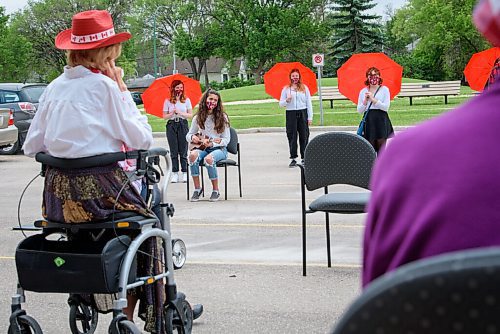 JESSE BOILY  / WINNIPEG FREE PRESS
Camila Rodriguez, a grade 9 student with the Grant Park High school performance choir performs for the residents of Bethel Place on Thursday. The students performed two concerts so that more residents could see the concert. This was the first time many of the students had seen each other in up to 3 months as they have been socially distancing and doing online classes.  Thursday, June 18, 2020.
Reporter:
