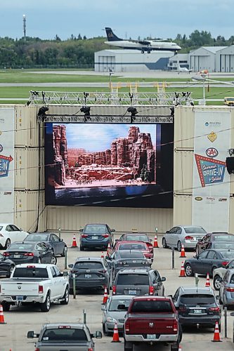 SHANNON VANRAES / WINNIPEG FREE PRESS
A partnership between AVentPro, CAA Manitoba and the Winnipeg Airport Authority has brought a drive-in movie theatre to an airport parking lot. Motorists watched Night at the Museum on June 18, 2020.